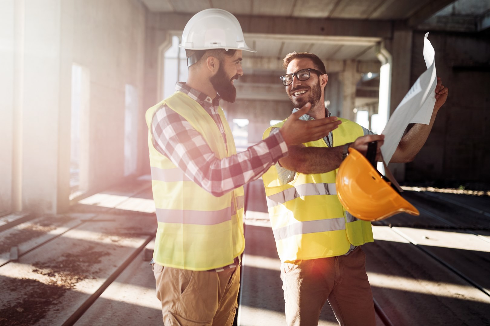 Portrait of construction engineers working on building site