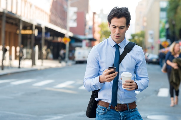 Man texting on phone using smartphone