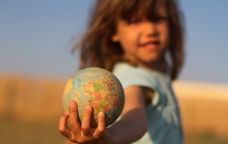 hand holding an earth